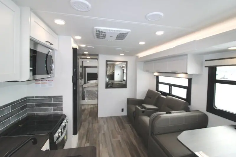 Salon et cuisine du Jayco Greyhawk 30Z avec mobilier gris.